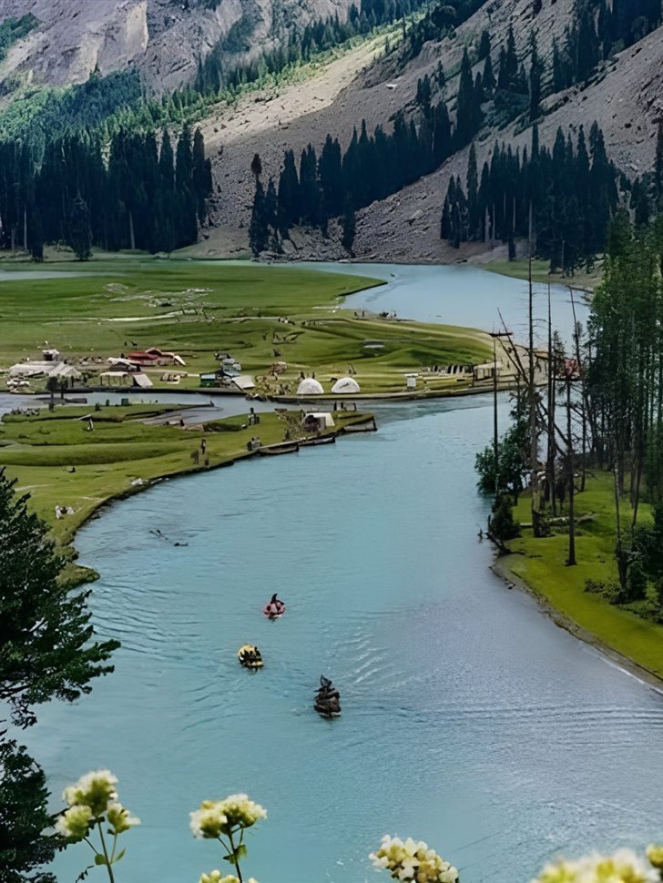 Mahodand Lake near Kalam Valley with green meadows, a winding river and camping pods.