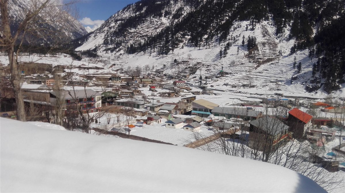 Kalam town under snow in winter, seen from the hillside above