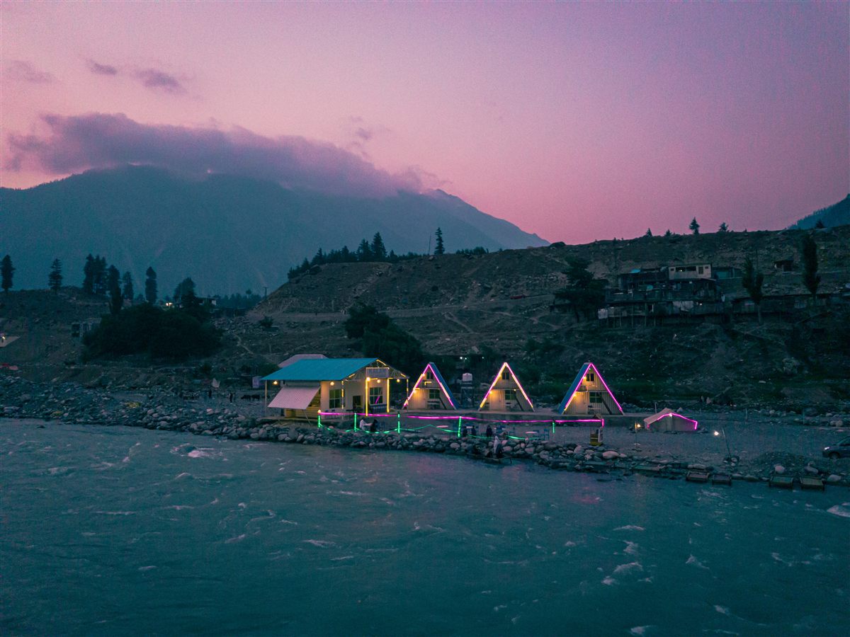 Riverside huts on the Swat River at Kalam on a summer evening