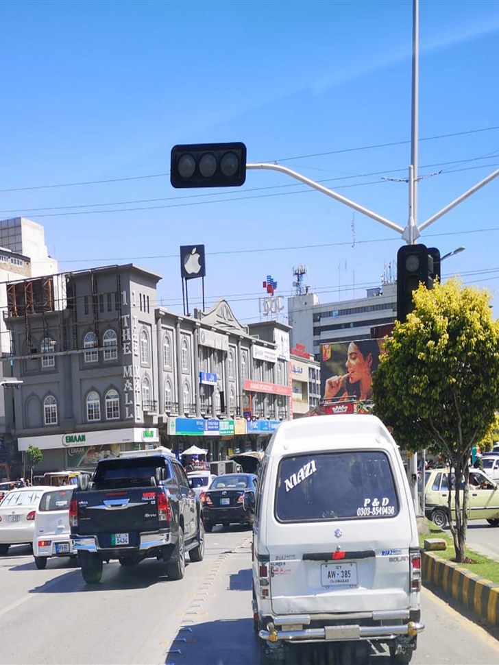 Street scene in Saddar Rawalpindi with the old Mall building and daytime traffic.