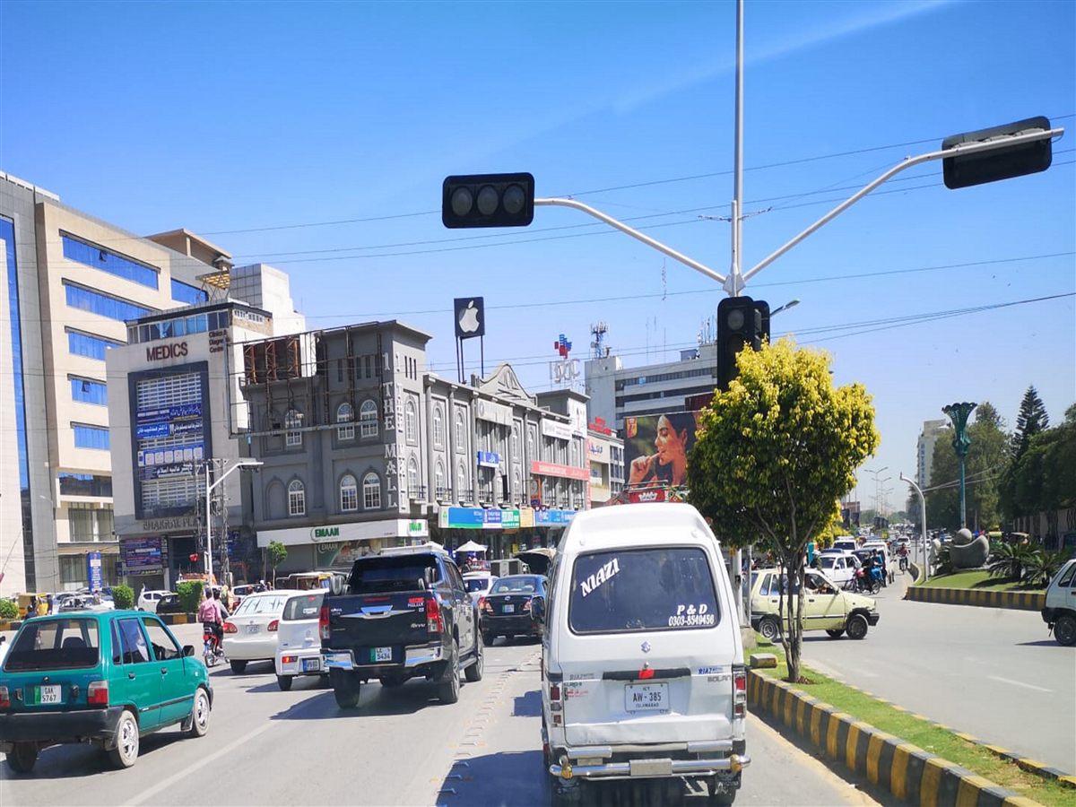 Street scene in Saddar Rawalpindi with the old Mall building and daytime traffic.