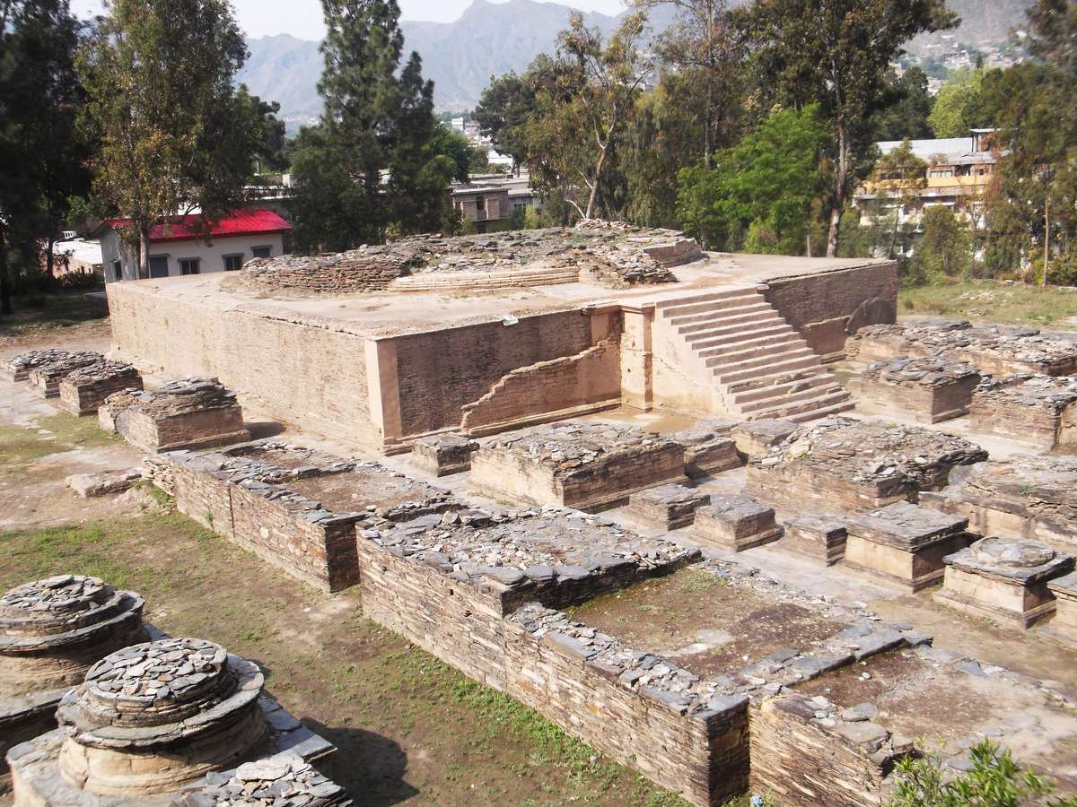 The base of the main stupa at Butkara I surrounded by smaller votive stupas