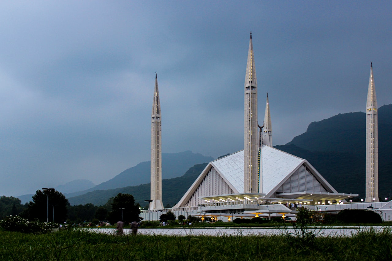 Faisal Mosque Islamabad with its white minarets against the Margalla Hills, about 25 minutes from LEORK Hotels Rawalpindi