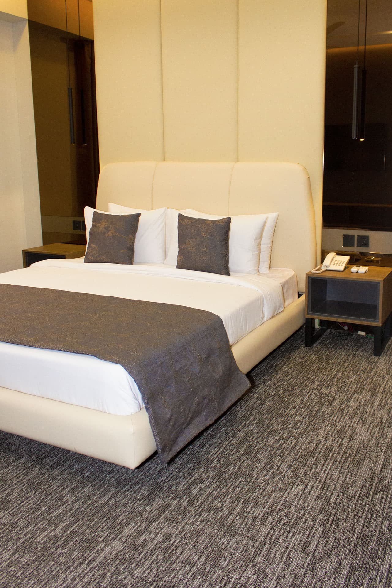 King Room mobile view with bed, side tables, and headboard at LEORK Hotels Rawalpindi Islamabad