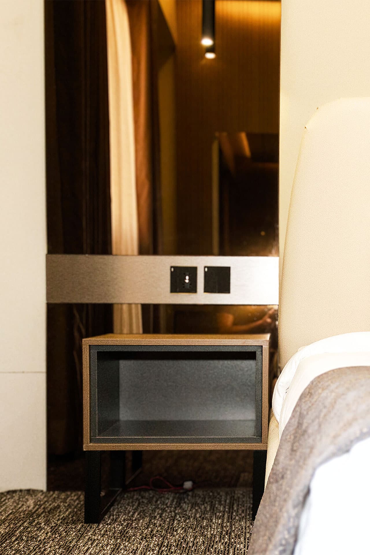 King Room mobile close-up with bed, side table, mirror, and furniture at LEORK Hotels Rawalpindi Islamabad