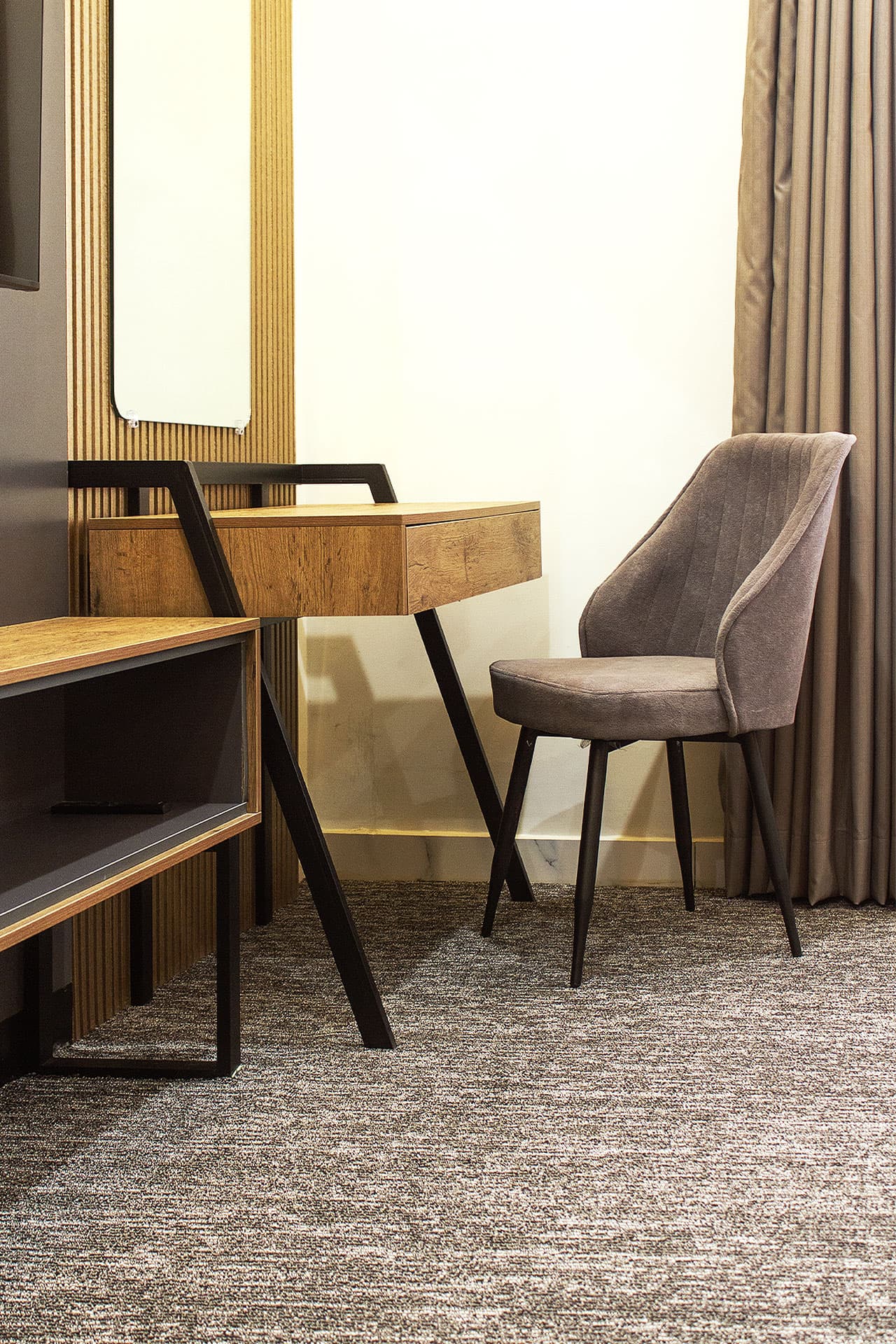 King Room mobile view with dresser, study table, and media wall at LEORK Hotels Rawalpindi Islamabad