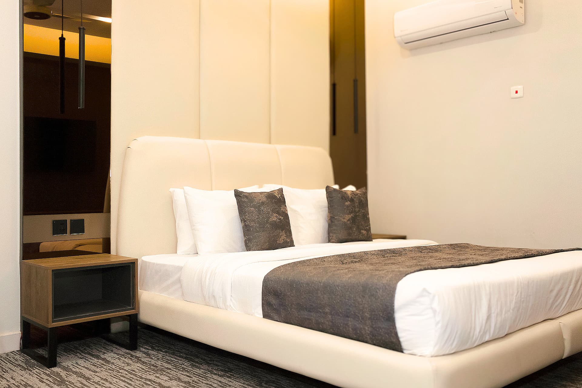 King Room long shot with full room, bed, side tables, headboard, pillows at LEORK Hotels Rawalpindi Islamabad