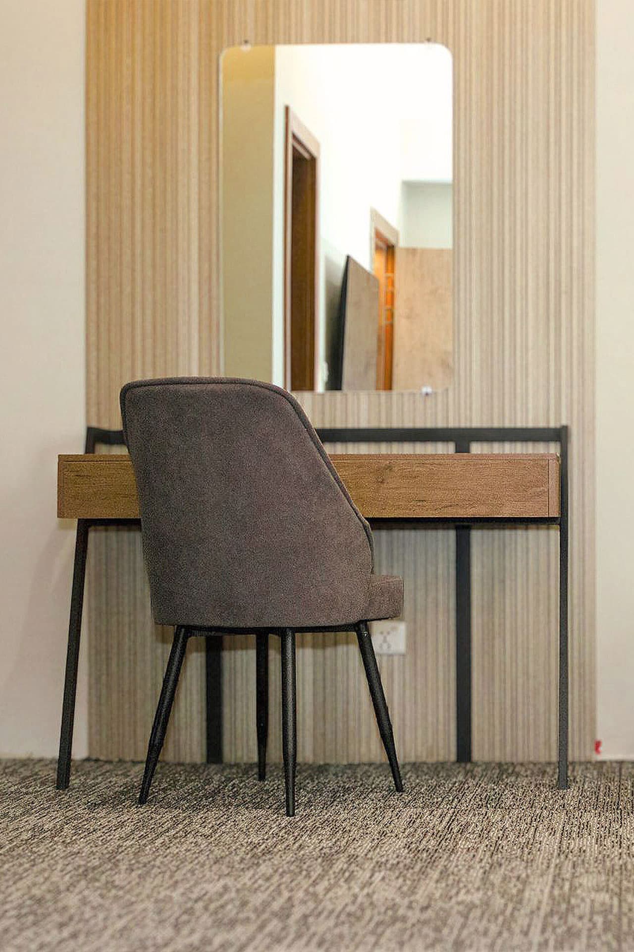 Twin Room mobile semi-view with study table, AC, wall panels, bed, and carpet at LEORK Hotels Rawalpindi Islamabad